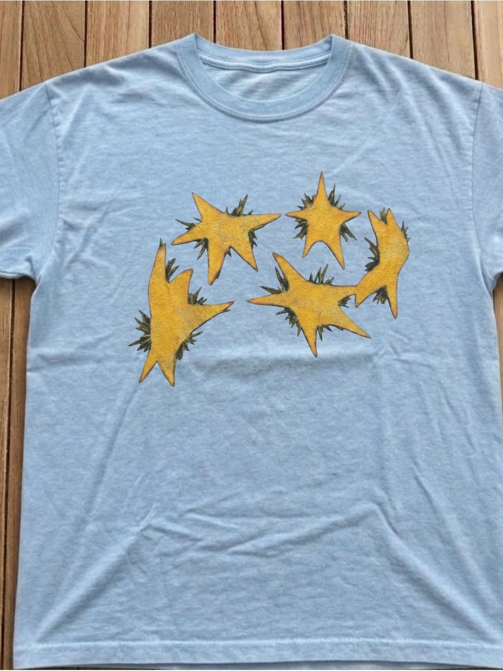 Light Blue Graphic Tee with Yellow Starburst